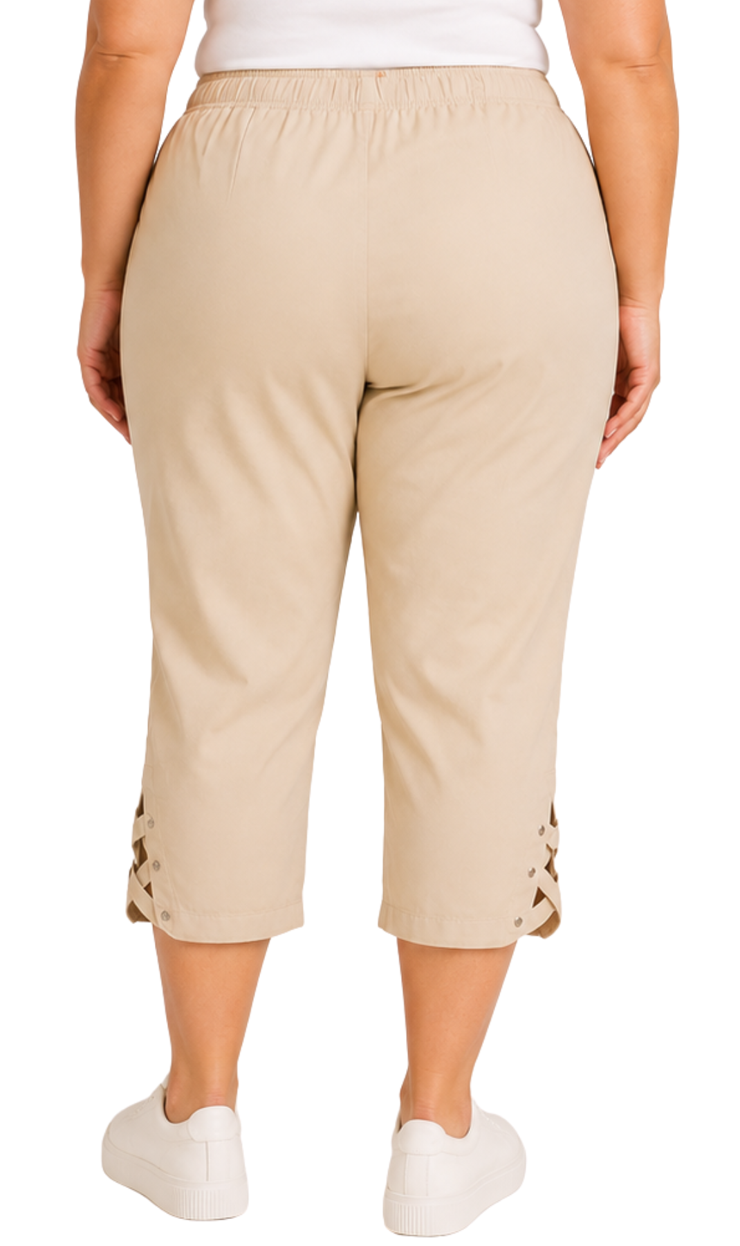 A person shown from the back wearing beige cropped pants with lace-up detailing at the hem, paired with a white top and white sneakers on a plain white background.