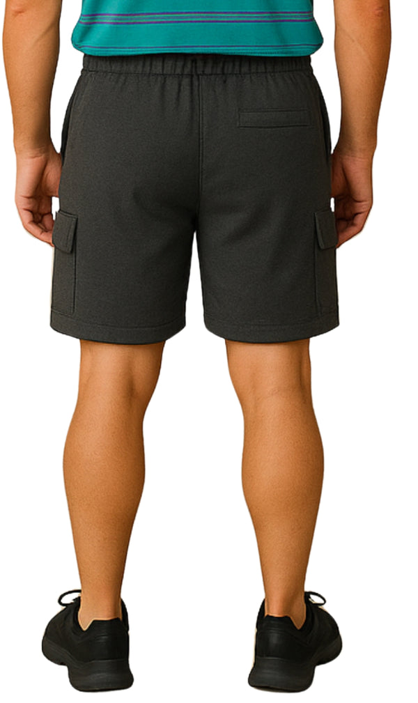 Person wearing black cargo shorts on a white background BACK