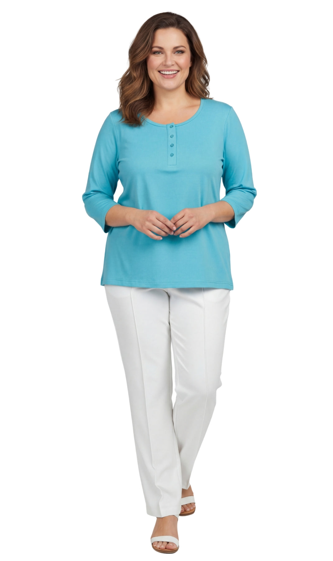 Woman wearing a turquoise top and white pants on a white background