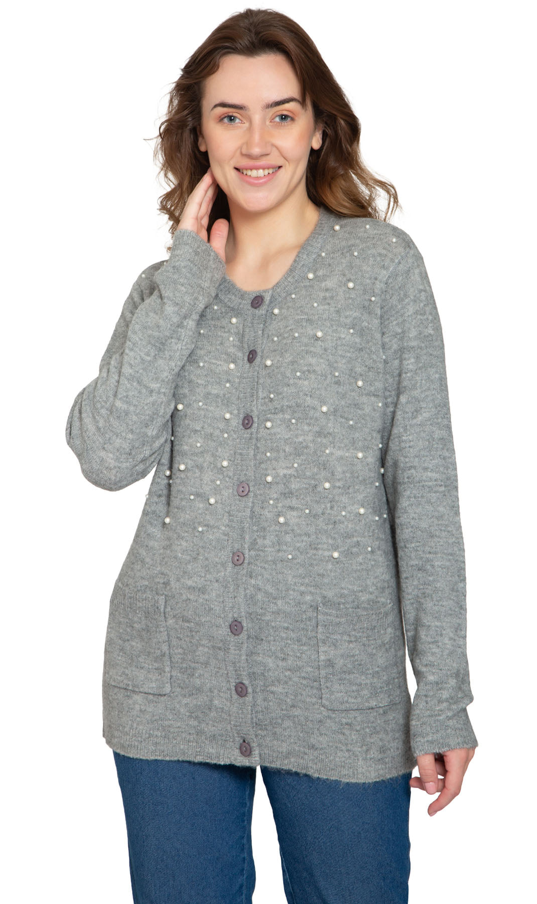 A woman wearing a purple cardigan with faux pearl accents on the front and pearl buttons. The cardigan has a crew neck and two front patch pockets.