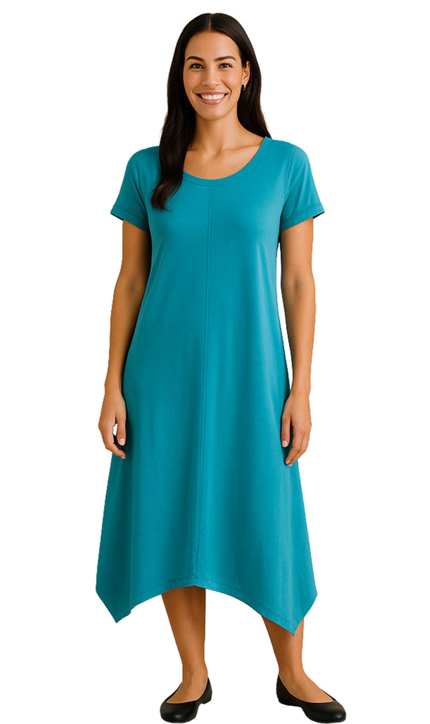 Woman wearing a teal dress on a white background